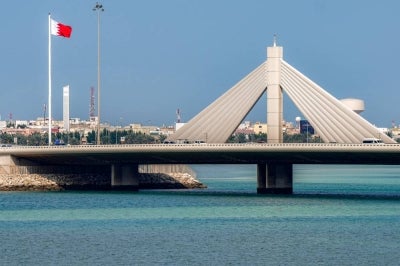 Vehicles move along the Muharraq Bridge in Bahrain's capital Manama on March 11, 2026. - (Photo by AFP)