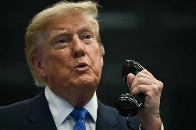 US President Donald Trump talks on the phone with crew members of the International Space Station (ISS) at Mission Control Center at NASA Lyndon B. Johnson Space Center in Houston, Texas, on Aug 28, 2026. - (Photo by KENT NISHIMURA / AFP)