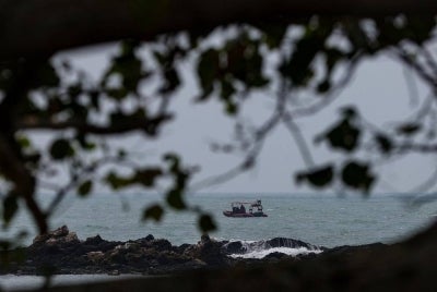 Fire and Rescue Department personnel continued the search and rescue (SAR) operation for two more missing victims on its third day at Tanjung Lompat Beach today. - Photo by Bernama