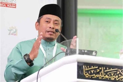 Ahmad Fadhli delivering the closing address at Pas' 72nd annual muktamar at Pusat Tarbiah Islamiah Kelantan (Putik), Pengkalan Chepa, on Saturday. 