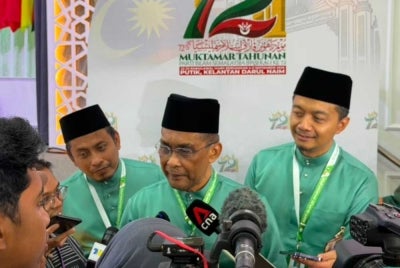 Pas secretary-general Datuk Seri Takiyuddin Hassan with media members at Pusat Tarbiyah Islam Kelantan (Putik) in Kota Bharu, today.