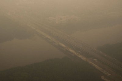 Haze from Indonesian forest fires blanketing a bridge in Kuching, the capital city of Sarawak. Photo by AFP