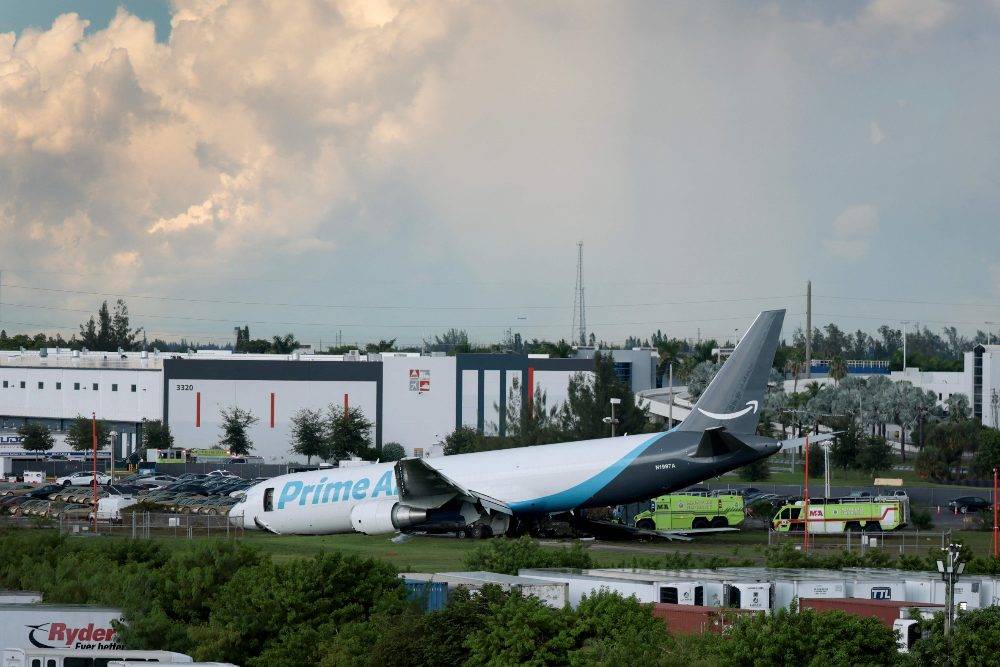 The tail section of a cargo plane is seen at Miami International Airport after it overran the runway at Miami International Airport in Miami, Florida. Photo by AFP