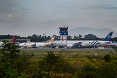 Airplanes sit on the tarmac at Iskandar Muda airport in Blang Bintang after Indonesia halted operations at its main international airport outside Jakarta. Photo by AFP