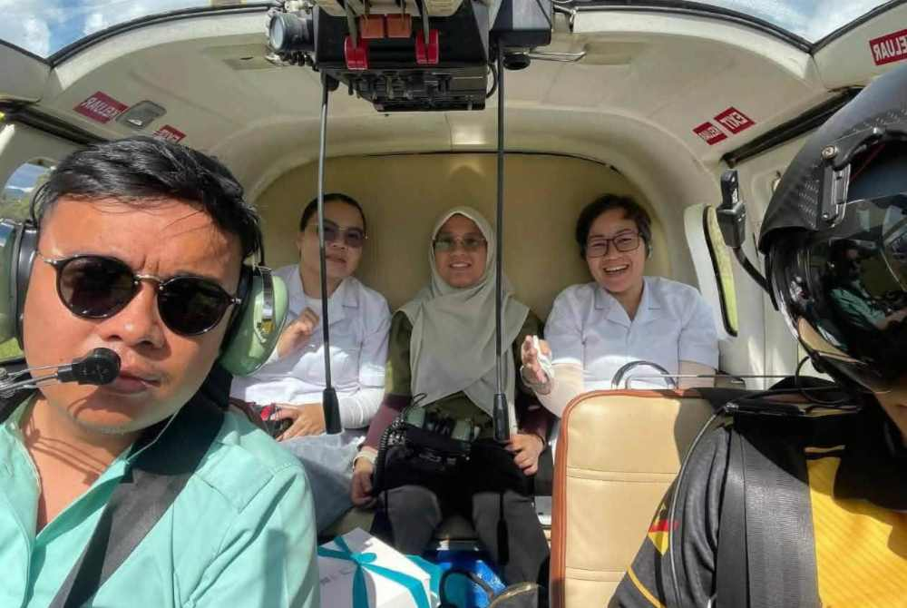 Dr Ainul Baraah Kamaruddin, 32, (back, centre) was among the victims involved in the helicopter crash in Ulu Baram, Sarawak, on Tuesday.