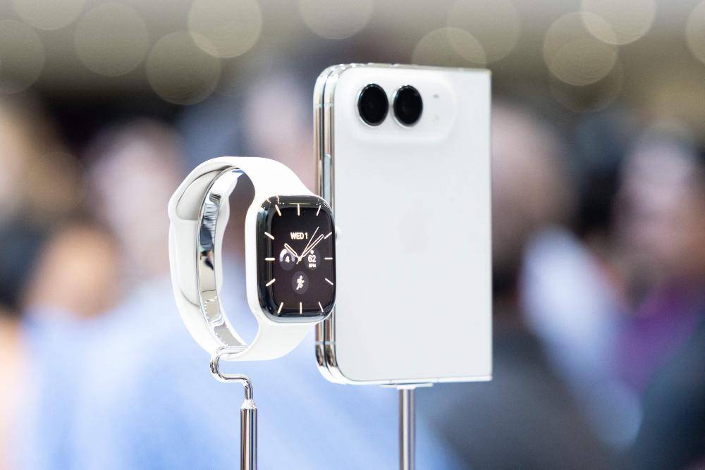 An Apple Watch series 12 and iPhone Duo are displayed at Apple's 