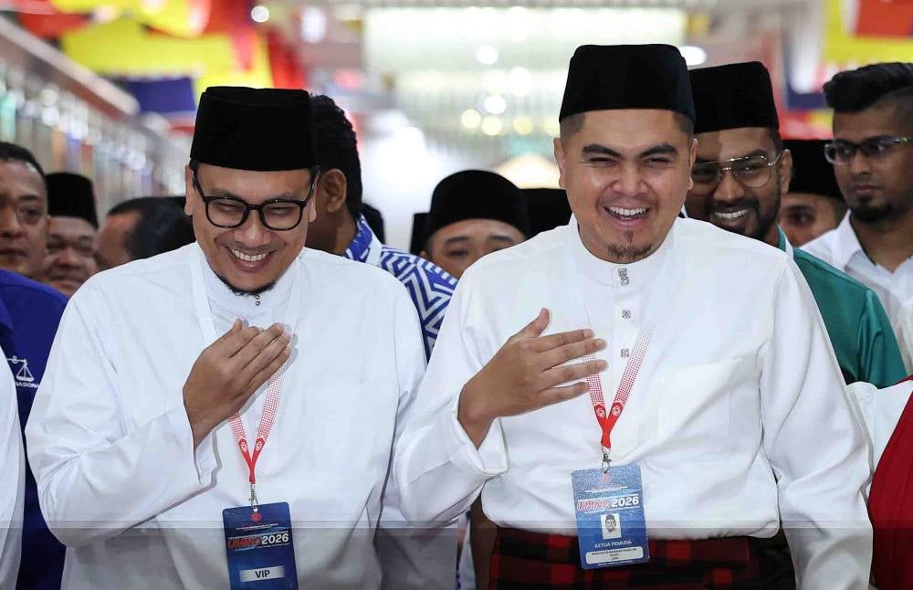 Umno Youth chief Datuk Dr Muhamad Akmal Saleh (right), together with Pas Youth chief Afnan Hamimi Taib Azamudden (left), at the Opening of the 2026 Umno Youth Movement General Assembly in conjunction with the 2026 Umno General Assembly at Dewan Merdeka, World Trade Centre Kuala Lumpur, today. - Photo by Bernama