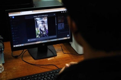 Members of the raid unit at the Department of National Parks, Wildlife and Plant Conservation (DNP) looking at illegal sales for protected wildlife on social media, at the DNP headquarters in Bangkok. Alongside weapons, drugs and human trafficking, the illegal wildlife trade is among the most widespread and profitable forms of organised crime globally, run by cross-border cartels. Photo by AFP