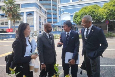 Amer (second from right) when met by reporters at the Dang Wangi District Police Headquarters (IPD) here on Thursday.