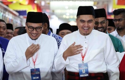 Umno Youth chief Datuk Dr Muhamad Akmal Saleh (right), together with Pas Youth chief Afnan Hamimi Taib Azamudden (left), at the Opening of the 2026 Umno Youth Movement General Assembly in conjunction with the 2026 Umno General Assembly at Dewan Merdeka, World Trade Centre Kuala Lumpur, today. - Photo by Bernama