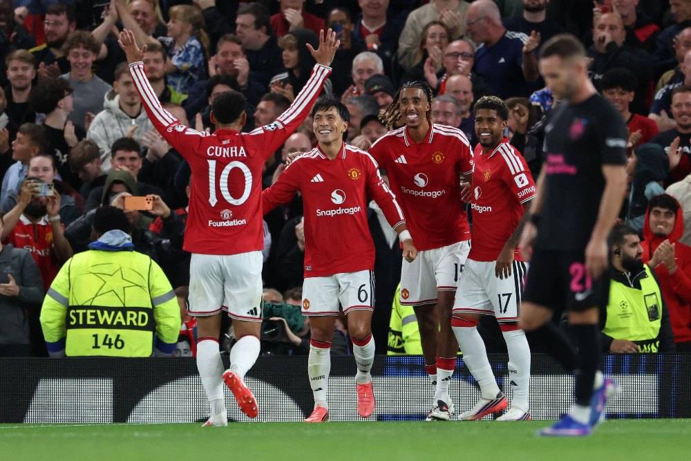 Manchester United's Argentinian defender #06 Lisandro Martinez (C) celebrates scoring the team's fourth goal during the UEFA Champions League football match between Manchester United and Sabah FK at Old Trafford in Manchester, north west England. Photo by Darren Staples/AFP