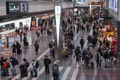 Travellers crowd the check-in area at Terminal 1 of Tokyo International Airport at Haneda on Jan 4, 2025, as millions of international and domestic passengers return home after the New Year's holidays. - (Photo by Richard A. Brooks / AFP)