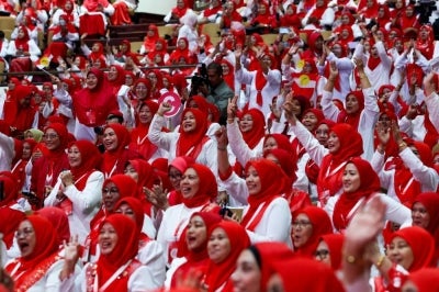 For many women in Umno, the demand for 30 per cent representation is older than some of the party's younger delegates. Photo by Bernama