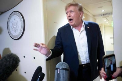 US President Donald Trump speaks to the press aboard Air Force One while flying to Joint Base Andrews, Maryland from Ireland on Sept 13, 2026. - (Photo by Brendan Smialowski / AFP)