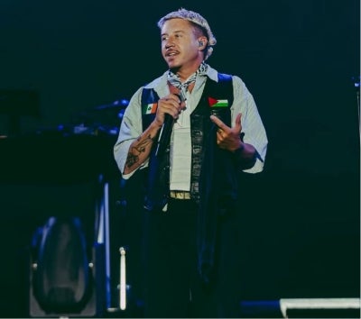 Macklemore performs on stage. The rapper was removed from Ed Sheeran’s US Loop Tour after venues objected to his public support for Palestine. Photo: Facebook