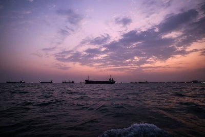 Vessels transit the Strait of Hormuz off the coast of the port city of Bandar Abbas in southern Iran on Sept 5, 2026. - (Photo by ATTA KENARE / AFP) /