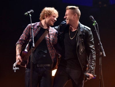 Recording artists Ed Sheeran (L) and Macklemore perform ontage during the 2014 iHeartRadio Music Festival at the MGM Grand Garden Arena on September 20, 2014 in Las Vegas, Nevada. (Photo by KEVIN WINTER / AFP)