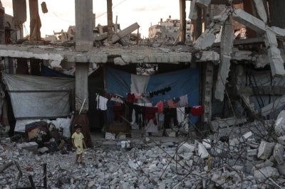 A Palestinian girl makes her way through the rubble of a heavily damaged building where displaced Palestinians have taken shelter in Khan Yunis in the southern Gaza Strip on Sept 19, 2026. - (Photo by Bashar Taleb / AFP)