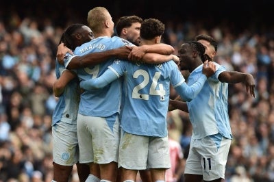 Manchester City's Norwegian striker #09 Erling Haaland (2L) celebrates with teammates after scoring their fifth goal during the English Premier League football match between Manchester City and Sunderland at the Etihad Stadium in Manchester, north west England. Photo by AFP