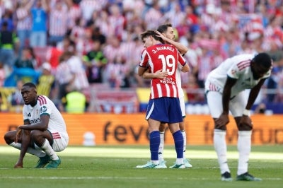 Players react after the Spanish league football match between Club Atletico de Madrid and Real Madrid CF at the Metropolitano stadium in Madrid on September 20, 2026. Atletico Madrid won 2-1. (Photo by Oscar DEL POZO / AFP)