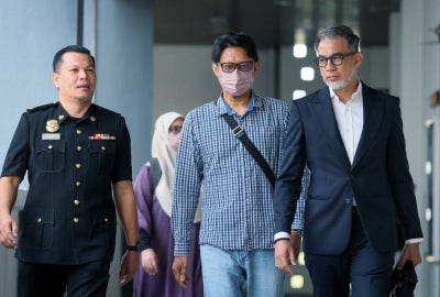 Former TH Properties deputy general manager of construction projects Tengku Kamarolhisham Tengku Kamaruddin pleaded not guilty in the Sessions Court today to abetting a criminal breach of trust involving RM14,000 in penalty funds collected from a contractor for a commercial building project owned by Tabung Haji (TH). - Photo by Bernama