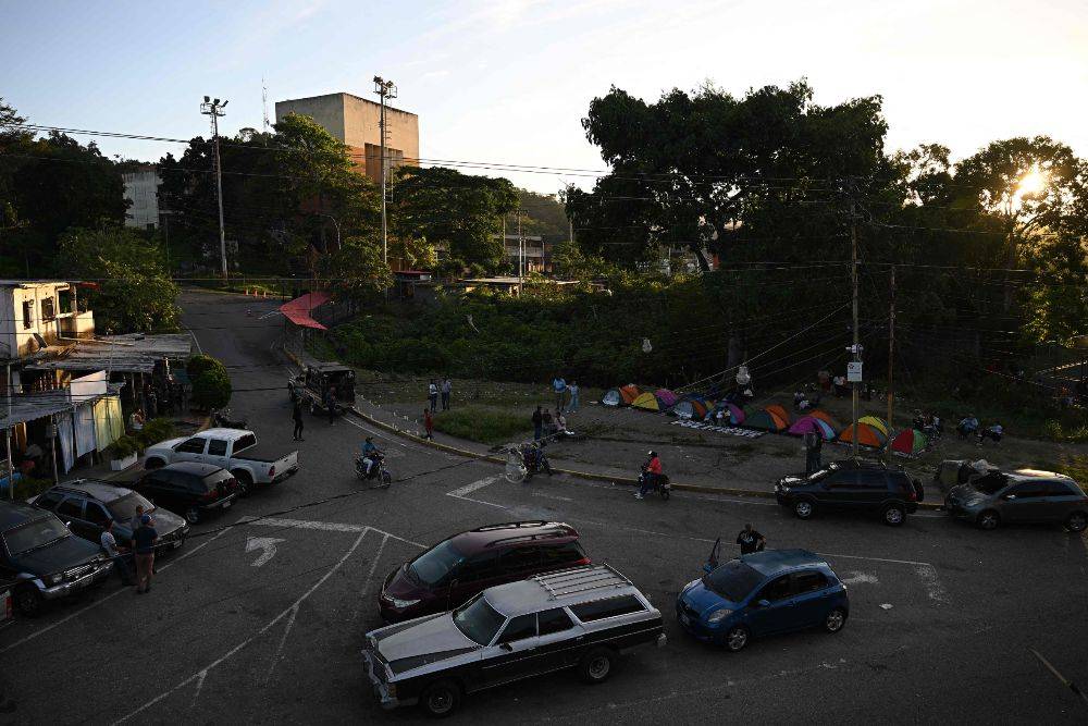 Relatives of inmates camp while waiting for news about the release of prisoners outside El Rodeo I prison in Guatire, Miranda State, some 30 kilometers east of Caracas on January 13, 2026. AFP FILE PIX