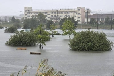Flooding inundates a park as heavy rain falls amid weather patterns due to Typhoon Dujuan in Ichikawa city, Chiba Prefecture. Typhoon Dujuan forced the cancellation of at least 275 flights in Japan on September 21 and prompted warnings of potentially record-breaking rainfall as the storm nears Tokyo. -AFP PIX