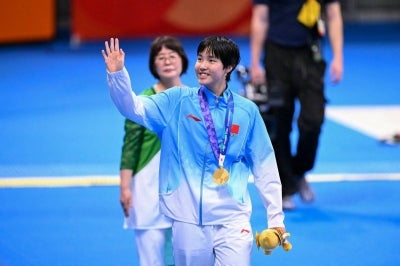 Yu smashed the Games record in winning the women's 200m butterfly on Sunday in Tokyo and then repeated the feat in Monday's 200m individual medley. (Photo by Yuichi YAMAZAKI / AFP)