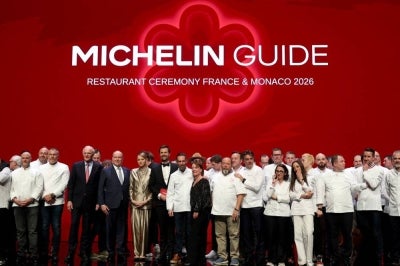 Award winners pose on stage at the end of the 2026 Michelin Guide award winners ceremony in Monaco on March 16, 2026. (Photo by Valery HACHE / AFP)