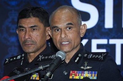 Selangor police chief Datuk Shazeli Kahar (right) with his deputy Mohd Zaini Abu Hassan during a press conference at the Selangor Contingent Police Headquarters, today. - Photo by Bernama