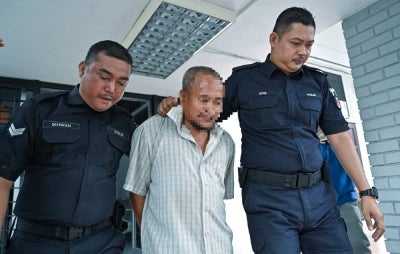 A father and son have been remanded for seven and two days respectively, starting today, to assist in the investigation of a murder case involving a woman with disabilities (PwD) in Kampung Cheh Kati, Kuala Kangsar, yesterday. - Photo by Bernama