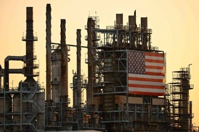A US flag is displayed outside of the Marathon Petroleum Corp. Los Angeles Refinery in Carson, California. Photo by AFP