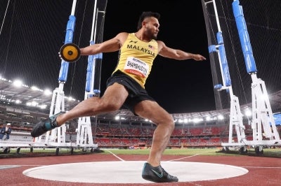 Malaysia's Muhammad Shamsh competes in the men's discus throw final during the 2026 Asian Games at Nagoya City Mizuho Park Athletic Stadium in Nagoya, Aichi Prefecture on September 24, 2026. (Photo by David GRAY / AFP)