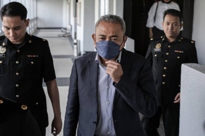 Former chief operating officer of Lembaga Tabung Haji Datuk Adi Azuan Abdul Ghani, 56, charged at the KL Sessions Court, today with accepting payment for house renovation costs of RM8,882.77 for a house nine years ago. - Photo by Bernama