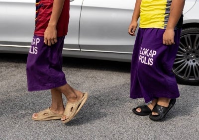 Two male students of a tahfiz school were brought before the magistrate’s court here today on charges of injuring another student with an iron on Sept 19. - Photo by Bernama