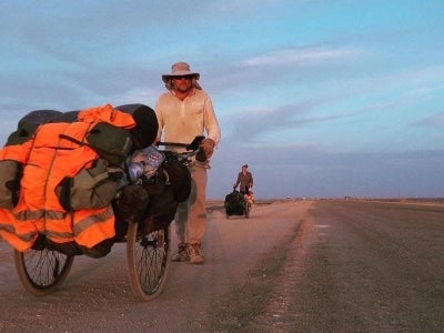 As he travels he pushes a cart containing all his belongings, nicknamed "the Beast". Photo by AFP