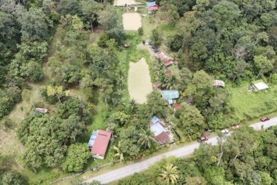 An aerial view of the properties claimed to be set for acquisition for the bypass project. - Photo by SYAHRIN KHAIRI
