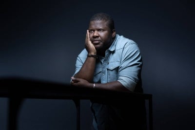 (FILES) Haitian-born Quebecois writer, poet, and novelist Thelyson Orelien, poses during a photo session in Paris on September 8, 2026. (Photo by Joel Saget / AFP)