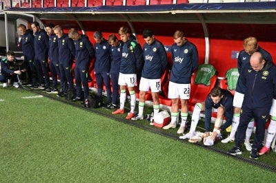 Members of the Republic of Ireland team stand with their heads bowed at the bench as the Israeli national anthem is played before the UEFA Nations League Group B3 between Israel and Republic of Ireland in Debrecen, Hungary. -AFP PIX