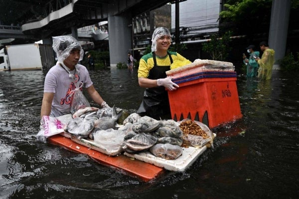 Vendors transport produce through floodwaters in Bang Kapi district in Bangkok on September 28, 2026. Eight people have died in flooding in Thailand since September 16, although none in the capital Bangkok which declared a disaster this weekend following heavy rains, the government said on September 28. -AFP PIX