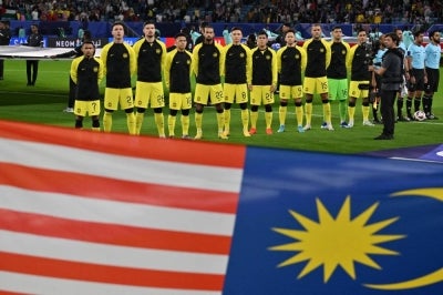  Malaysia currently lead Group A with four points, level with Indonesia but ahead on goal difference, while Singapore are third on three points and Bangladesh remain bottom without a point. (Photo by HECTOR RETAMAL / AFP)