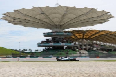 Mercedes's British driver Lewis Hamilton drives his car during the third practice session of the Formula One Malaysia Grand Prix in Sepang on September 30, 2017. (Photo by MANAN VATSYAYANA / AFP)