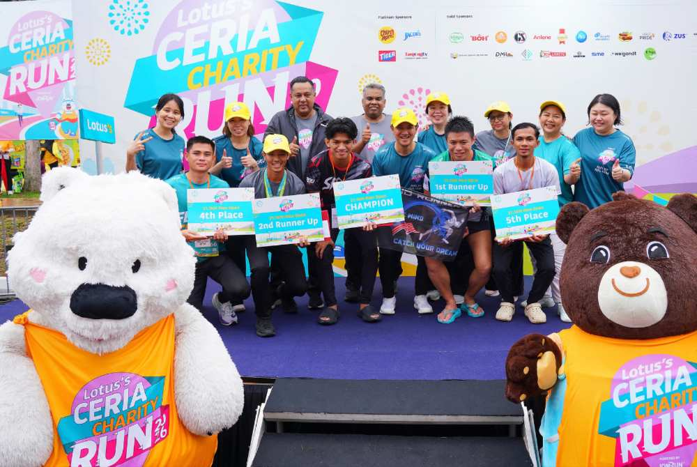 Store supervisor Muhammad Faaiz Danial Zawari, 25, became the inaugural 21.1km champion after completing the race in the Men’s Open category. - Photo by MOHD HALIM ABDUL WAHID