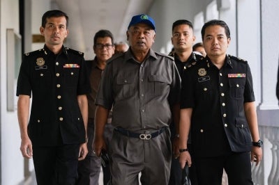 Former Felda DG Datuk Faizoull Ahmad, 66, was charged at the Sessions Court today with deceiving the authority’s board of directors in connection with a power of attorney used to transfer the ownership of 16 parcels of its land at Jalan Semarak in 2014. - Photo by Bernama