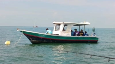 The body of Raja Mohd Rozi Raja Mohamud, 49, was found floating by local fishermen. Photo by Maritim Malaysia