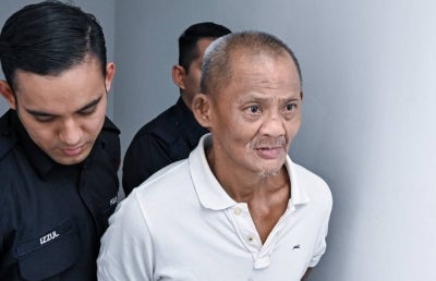Kim Keong is accused of murdering Chong Mun Long, 28, at the Grace Home Care Centre, Jalan Chemor, Tanjung Rambutan, between 3 am and 4 am on the said day. Photo by BERNAMA