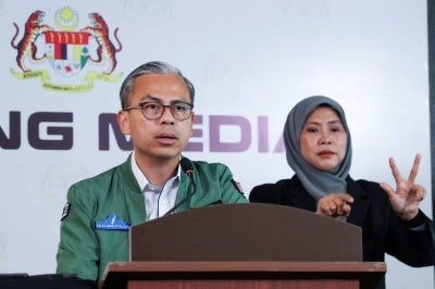 Communications Minister and Unity Government spokesperson Datuk Seri Fahmi Fadzil speaks during the weekly Cabinet media conference at Menara Komunikasi today. -Bernama PHOTO