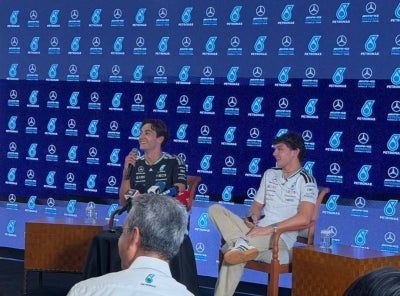 George Russell (left) with teammate Kimi Antonelli. - Sinar Daily photo