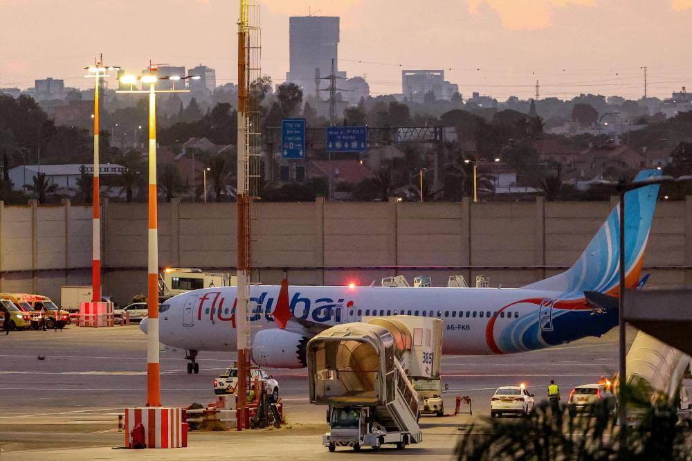 A flydubai Boeing 737 MAX 8 aircraft is pictured on the tarmac after landing at Israel's Ben Gurion Airport in Lod on Sept 30, 2026. - (Photo by JACK GUEZ / AFP)