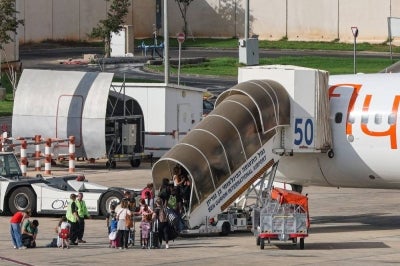 Passengers board a flydubai flight, bound for Dubai, before taking off from Ben Gurion Airport near Tel Aviv on Sept 30, 2026. (Photo by Jack GUEZ / AFP)